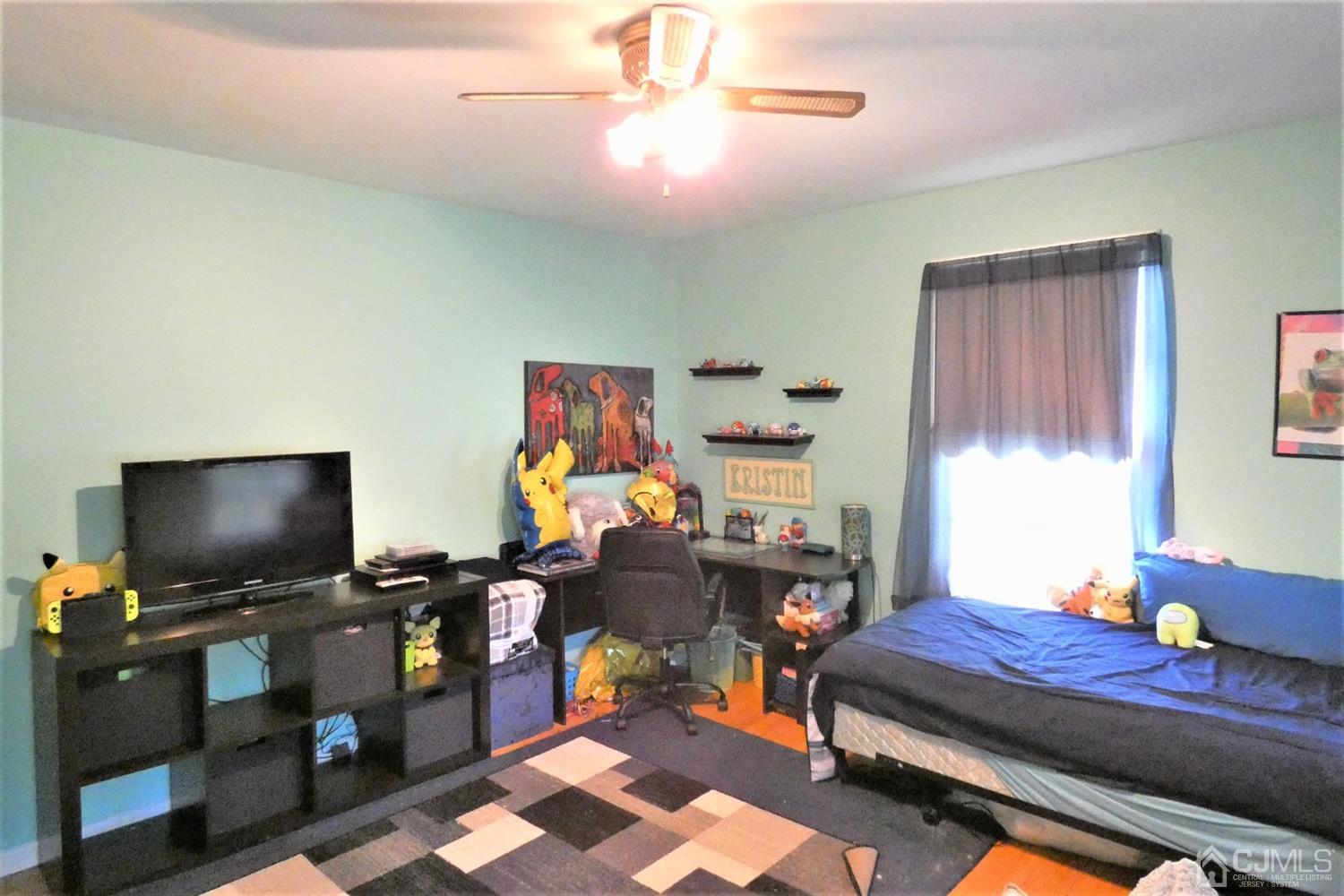 14 Apple Tree Road Flemington, NJ 08822 - Photo 21 of 33 a living room with furniture and a flat screen tv