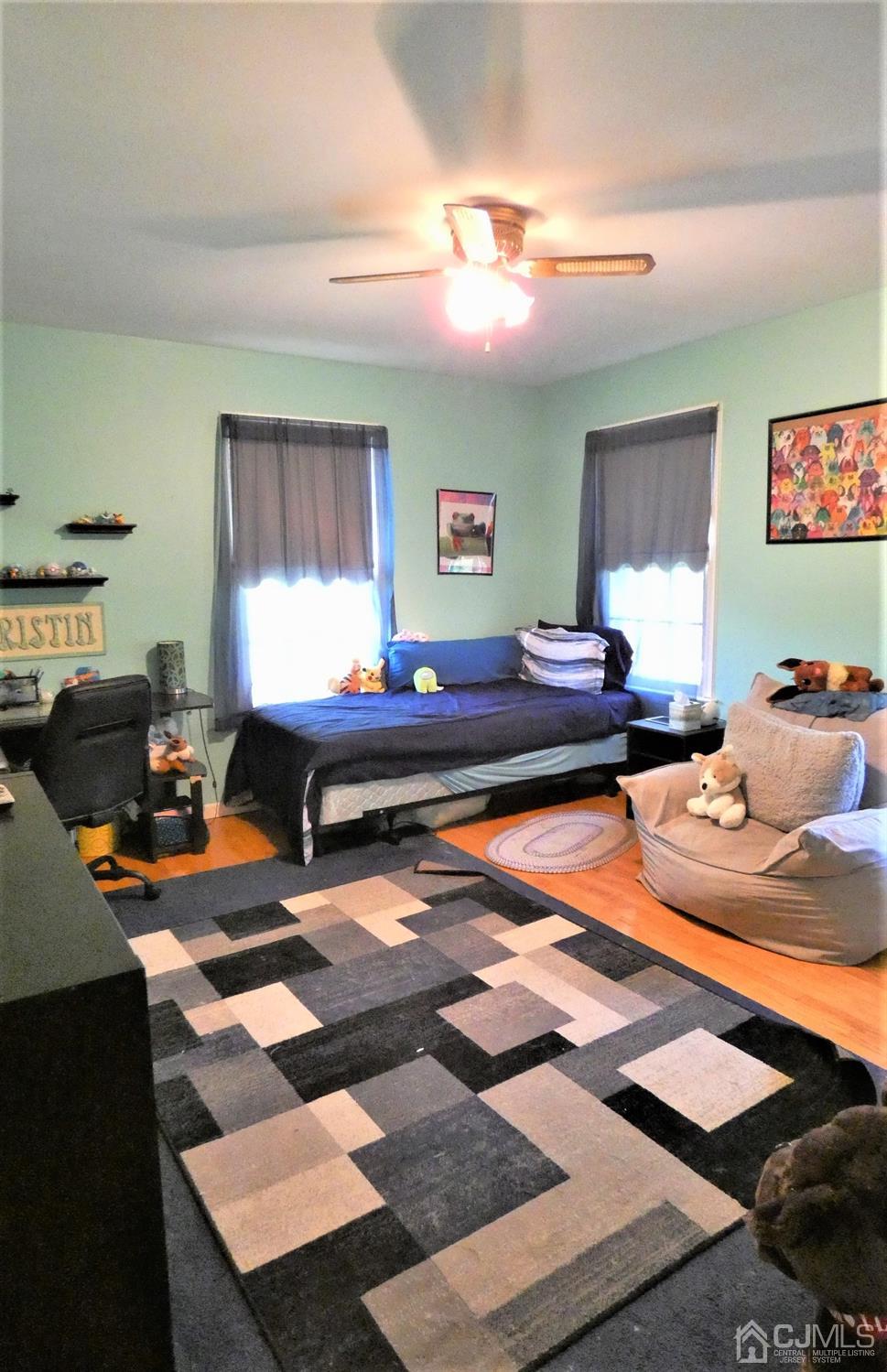 14 Apple Tree Road Flemington, NJ 08822 - Photo 22 of 33 a bedroom with a bed and wooden floor