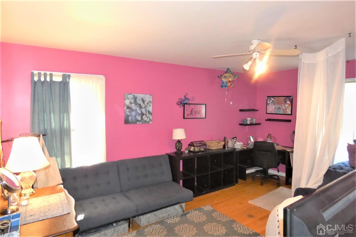 14 Apple Tree Road Flemington, NJ 08822 - Photo 24 of 33 a living room with furniture and a flat screen tv