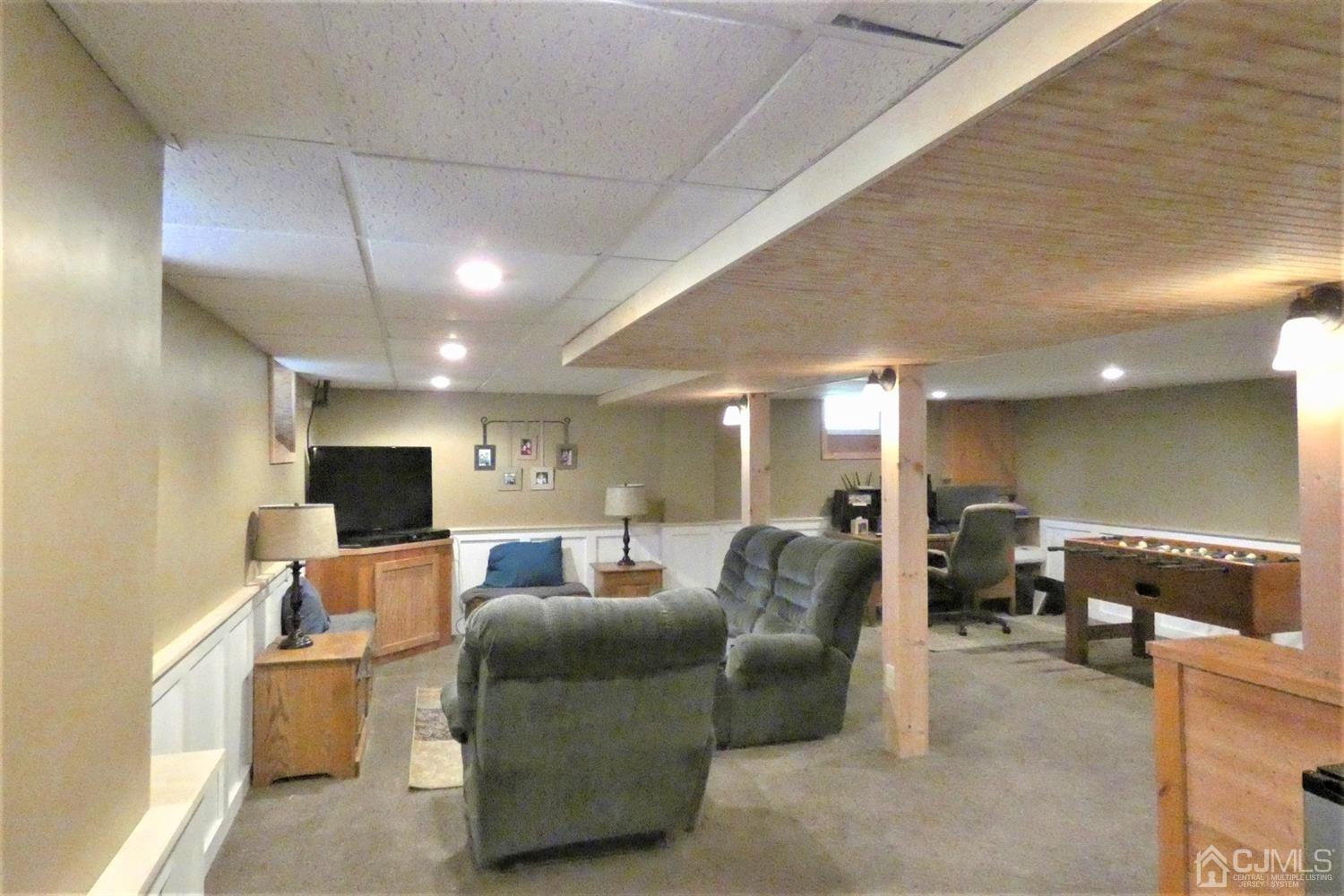 14 Apple Tree Road Flemington, NJ 08822 - Photo 26 of 33 a living room with furniture and a chandelier