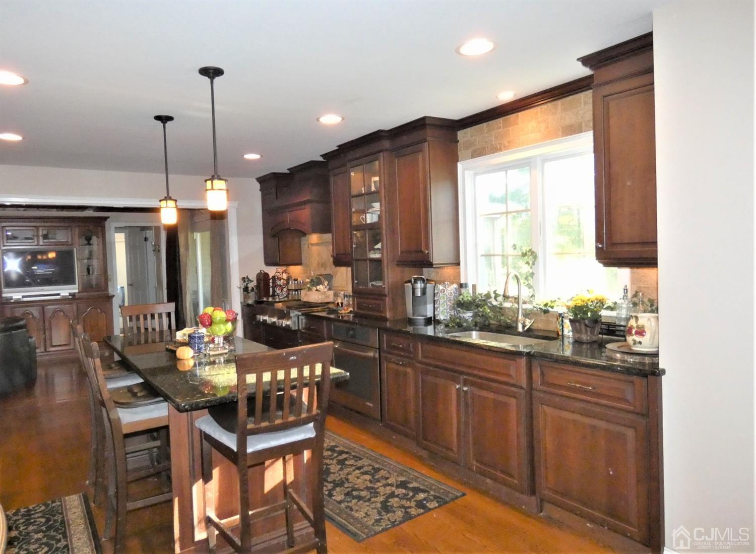 14 Apple Tree Road Flemington, NJ 08822 - Photo 8 of 33 a kitchen with a sink and chairs