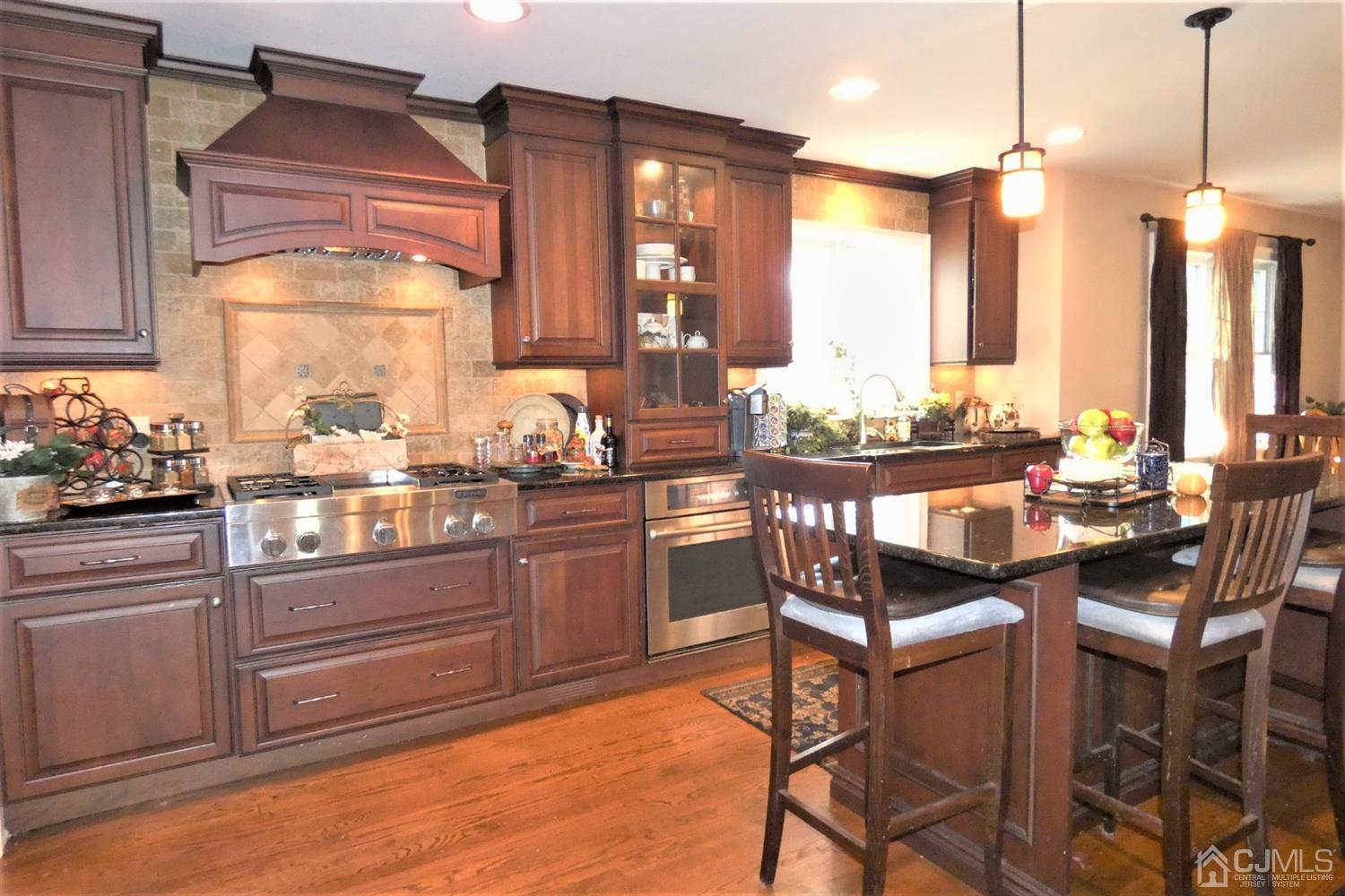14 Apple Tree Road Flemington, NJ 08822 - Photo 10 of 33 a kitchen with a sink and chairs