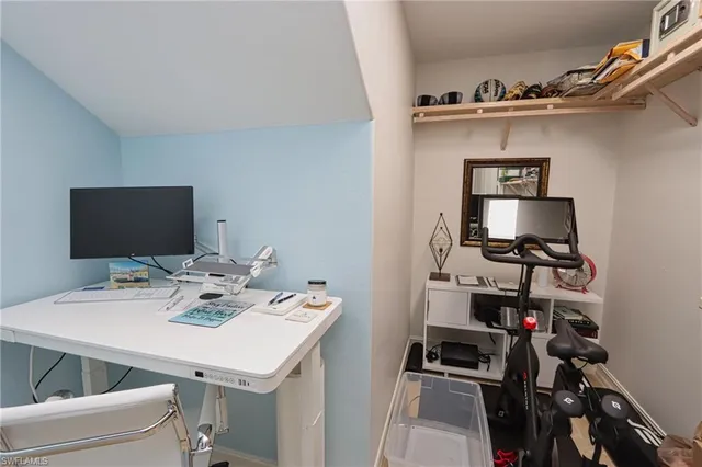 a view of a workspace with furniture