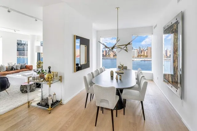 a living room with furniture and a dining table