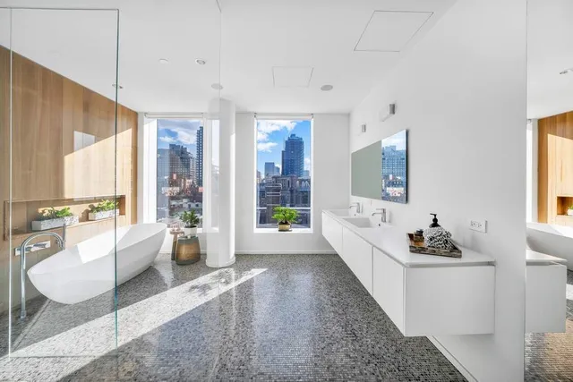 a swimming pool with outdoor seating and yard