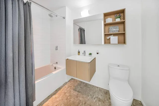 a bedroom with a bed and a table in it