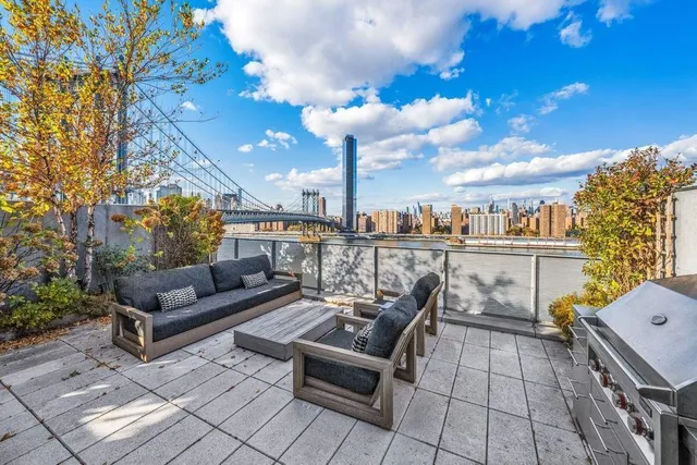a view of a terrace with furniture