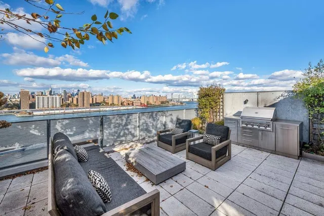 a view of a terrace with furniture