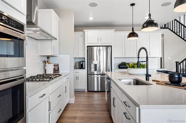 a view of workspace with cabinets and window