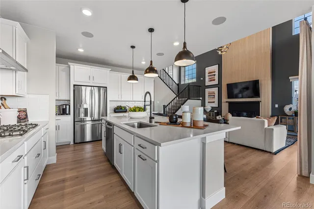 a living room with furniture and a table