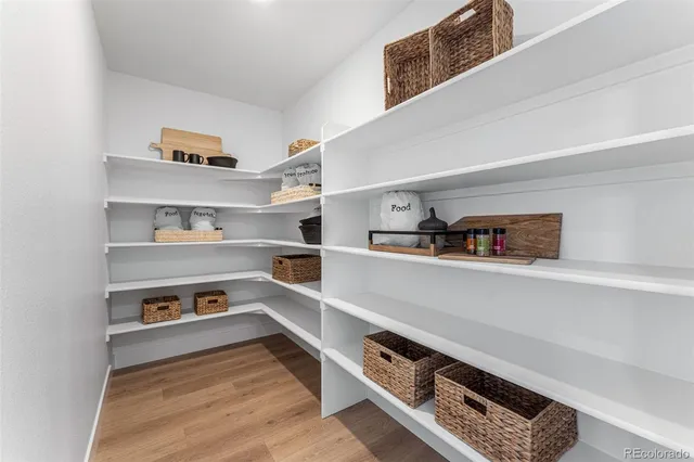 a living room with furniture and a lamp