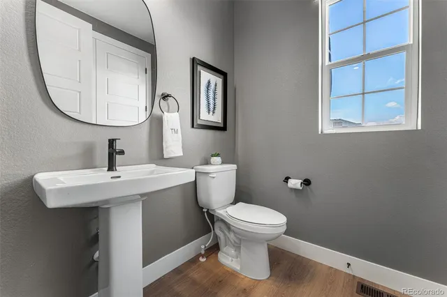 a bedroom with bed and a large window