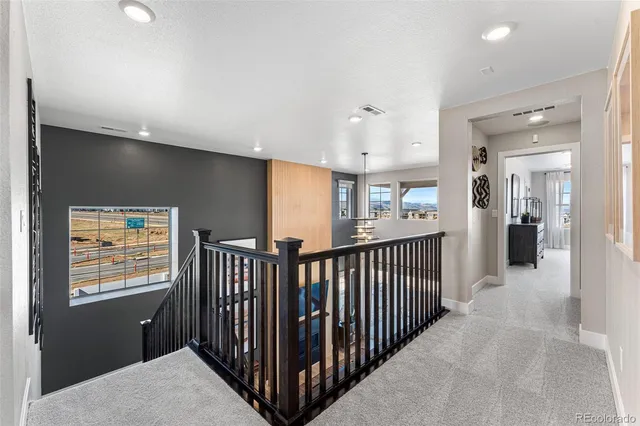 a bedroom with furniture and a chandelier