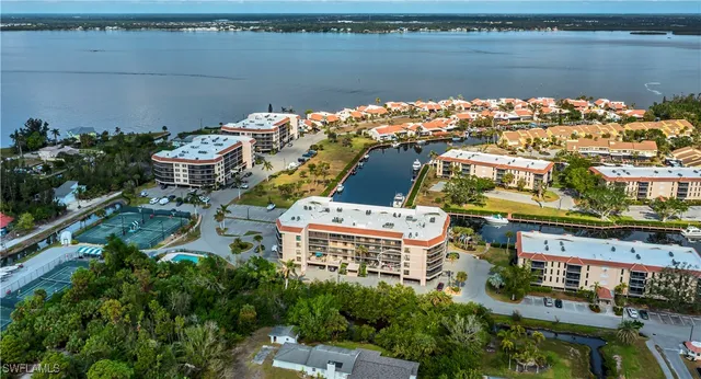 an aerial view of a house with a lake view