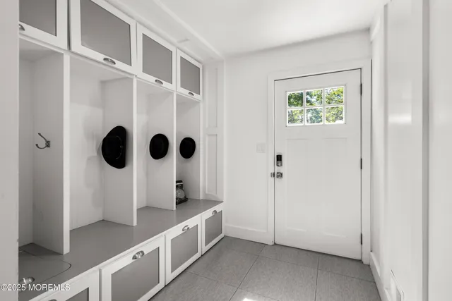 a bathroom with a sink and mirror with toilet