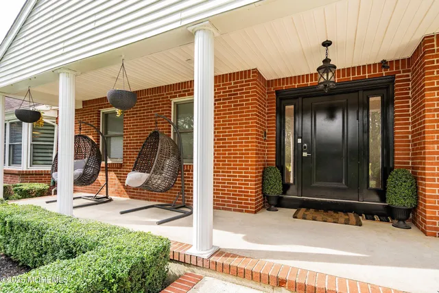 a view of a door with a bench