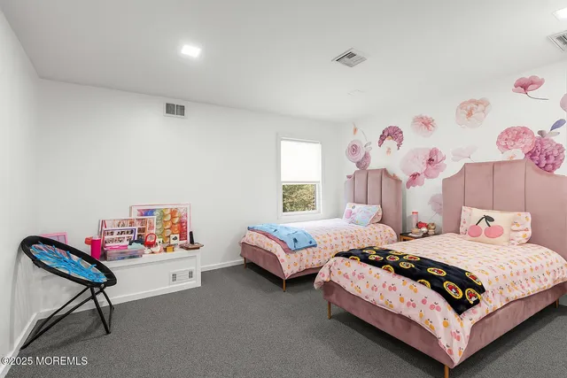 a spacious bathroom with a granite countertop sink a mirror and a bathtub