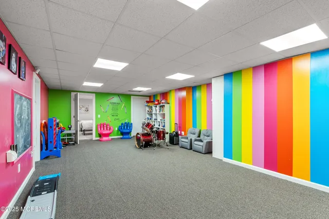 a room with a table and chairs in it