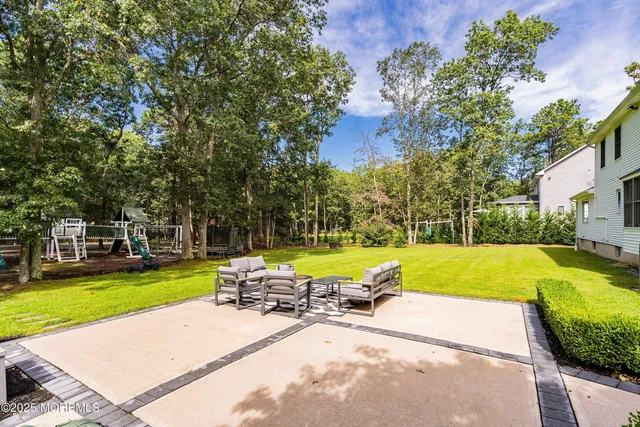 a front view of a house with yard and swimming pool
