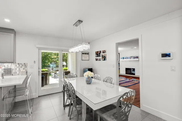 a kitchen with sink cabinets and stainless steel appliances