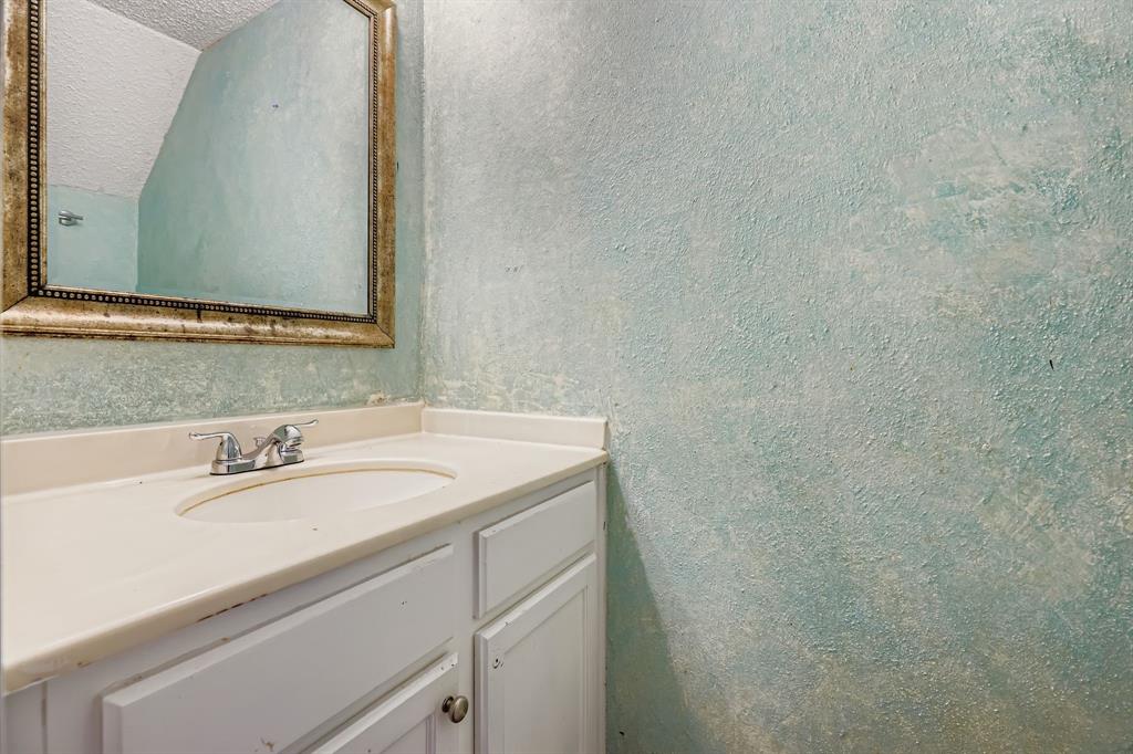 2400 Jupiter Road, Unit I2 Plano, TX 75074 - Photo 16 of 28 a bathroom with a sink and a mirror