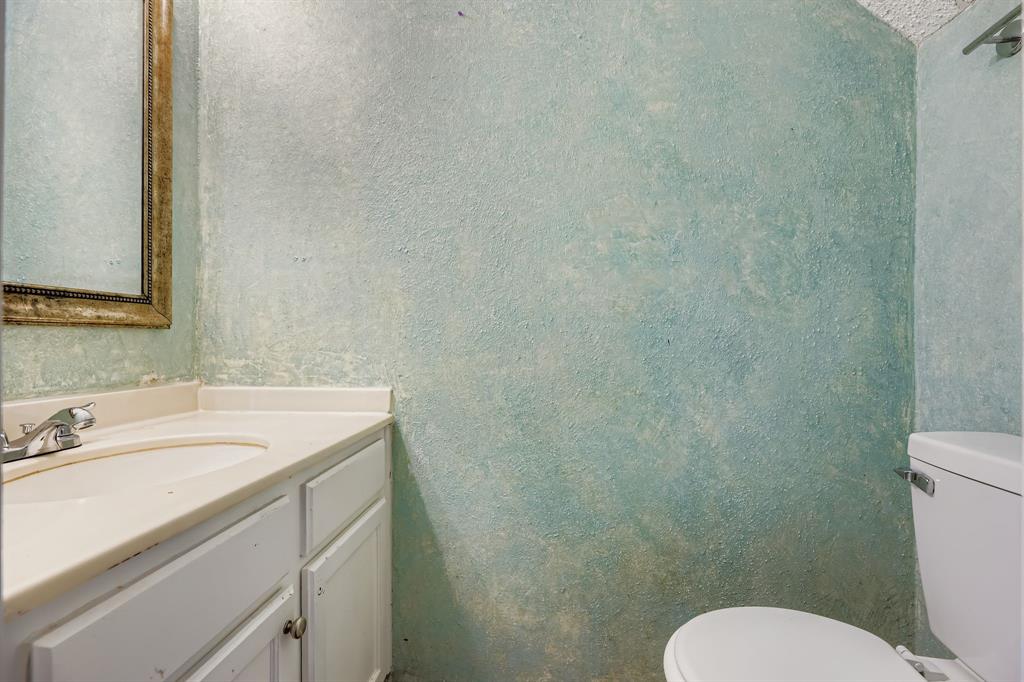 2400 Jupiter Road, Unit I2 Plano, TX 75074 - Photo 17 of 28 a bathroom with a sink and a toilet