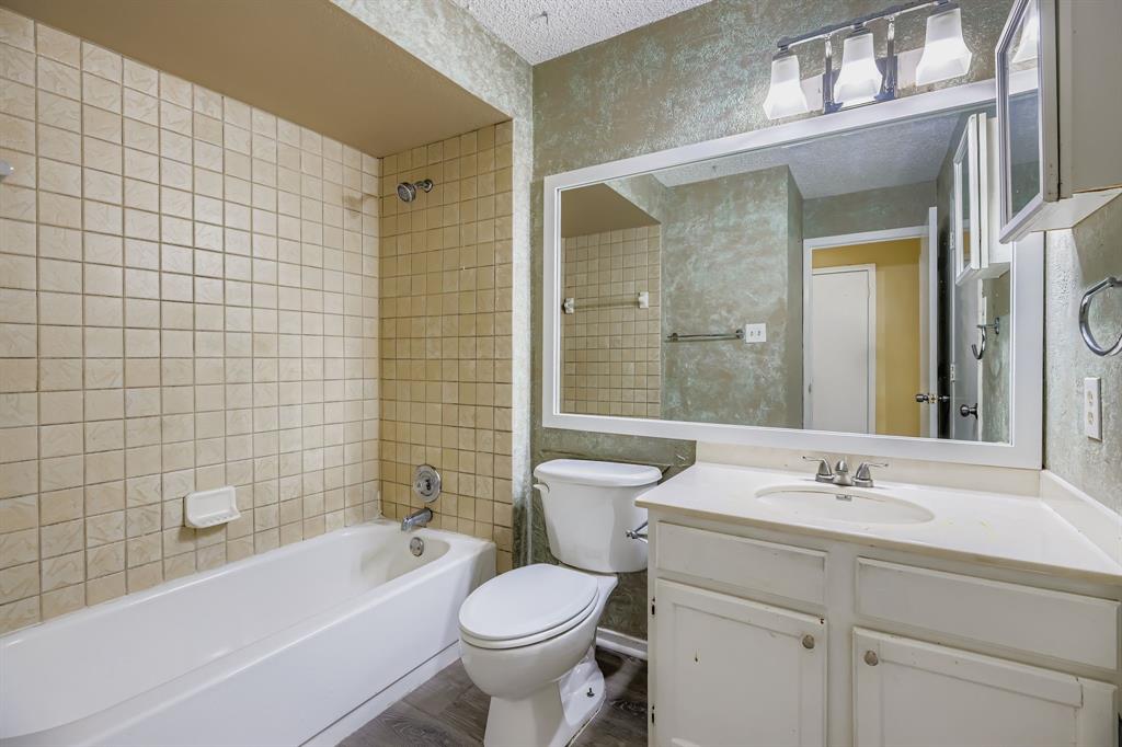 2400 Jupiter Road, Unit I2 Plano, TX 75074 - Photo 22 of 28 a bathroom with a sink toilet and shower