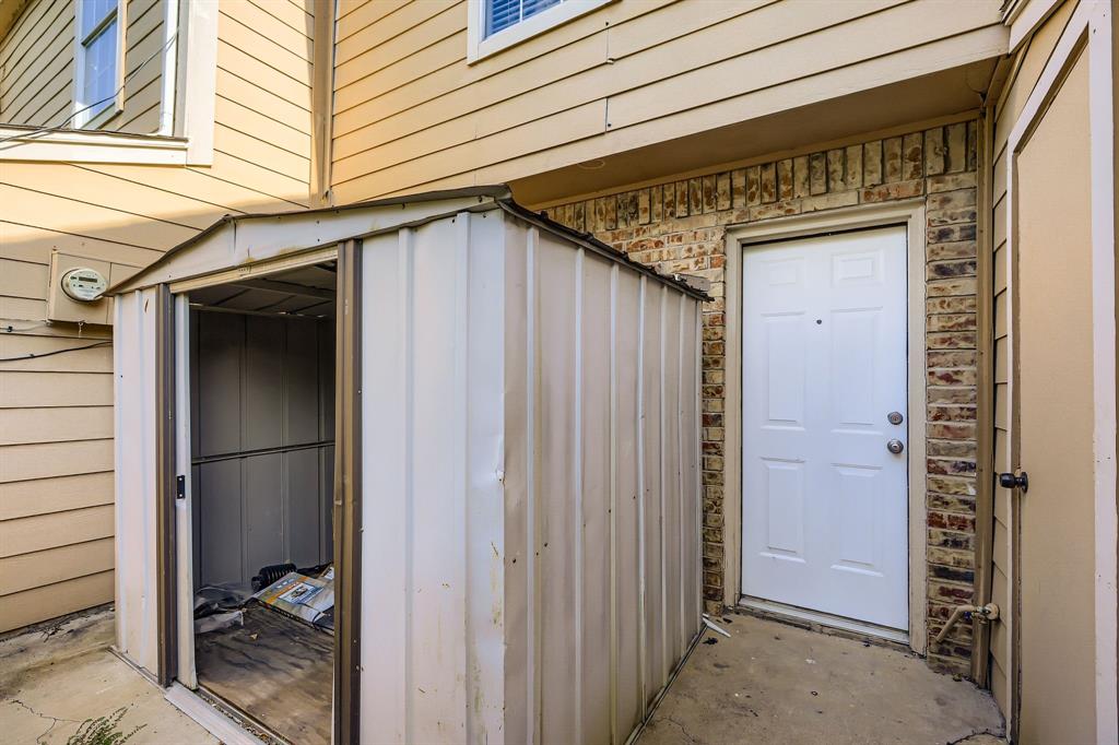 2400 Jupiter Road, Unit I2 Plano, TX 75074 - Photo 28 of 28 a view of a wooden door