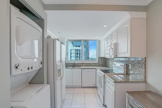 a room with furniture and two mirrors