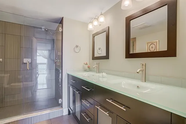 a large kitchen with a table and chairs