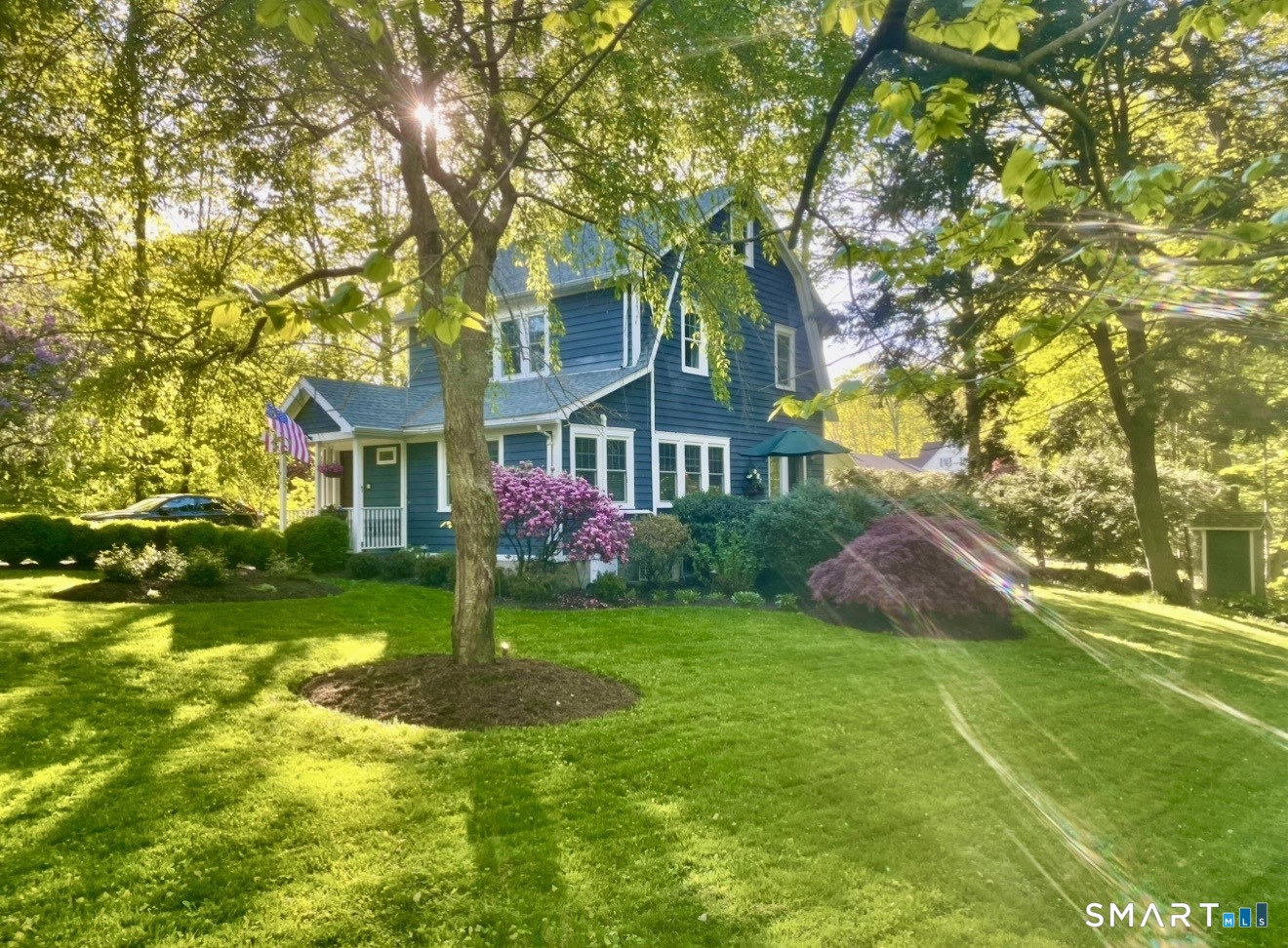 a front view of a house with garden