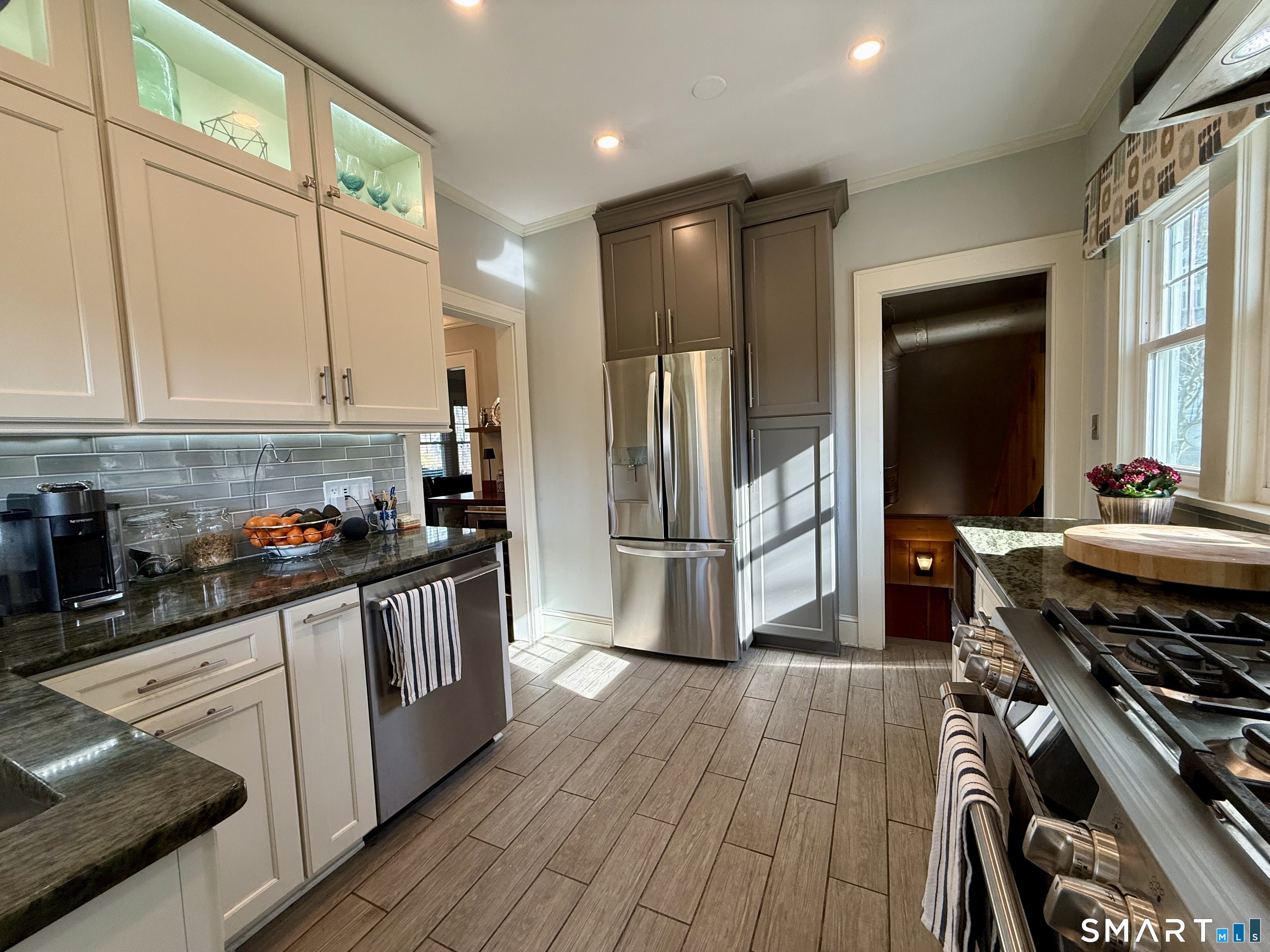 12 Sunset Pass Wilton, CT 06897 - Photo 13 of 31 a kitchen with stainless steel appliances a stove a refrigerator and a refrigerator