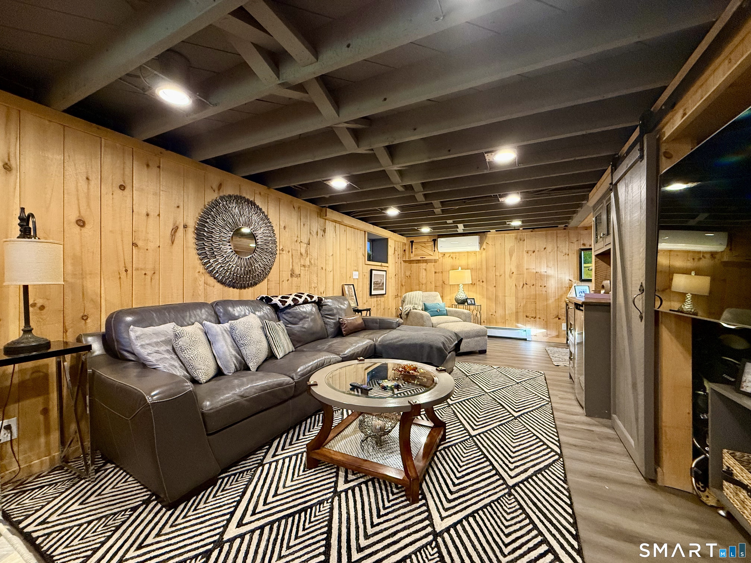 12 Sunset Pass Wilton, CT 06897 - Photo 24 of 31 a living room with furniture a ceiling fan and a rug