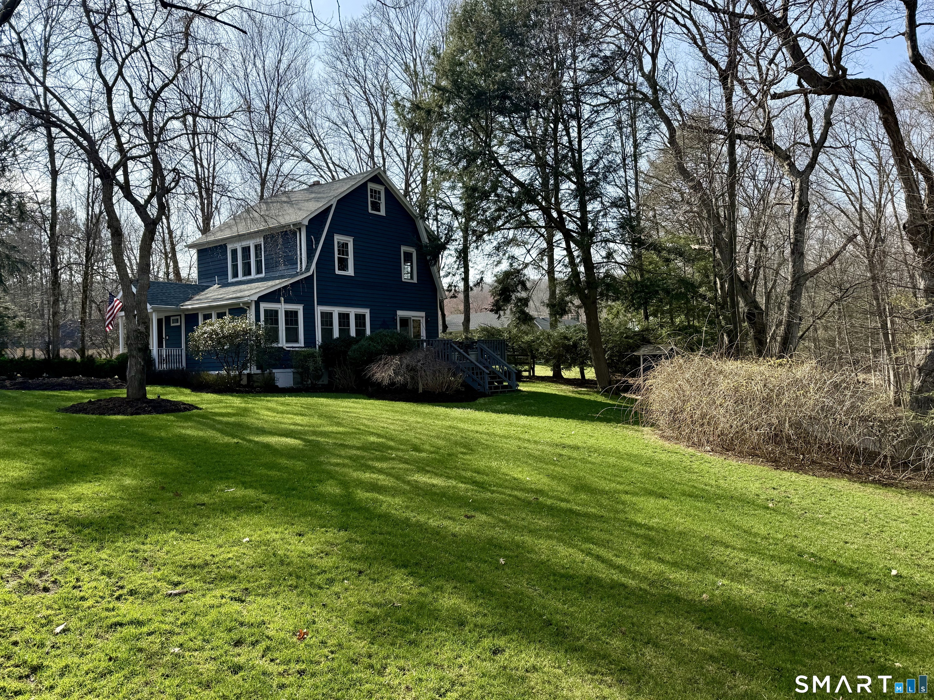 12 Sunset Pass Wilton, CT 06897 - Photo 25 of 31 a view of a big yard with plants and large trees