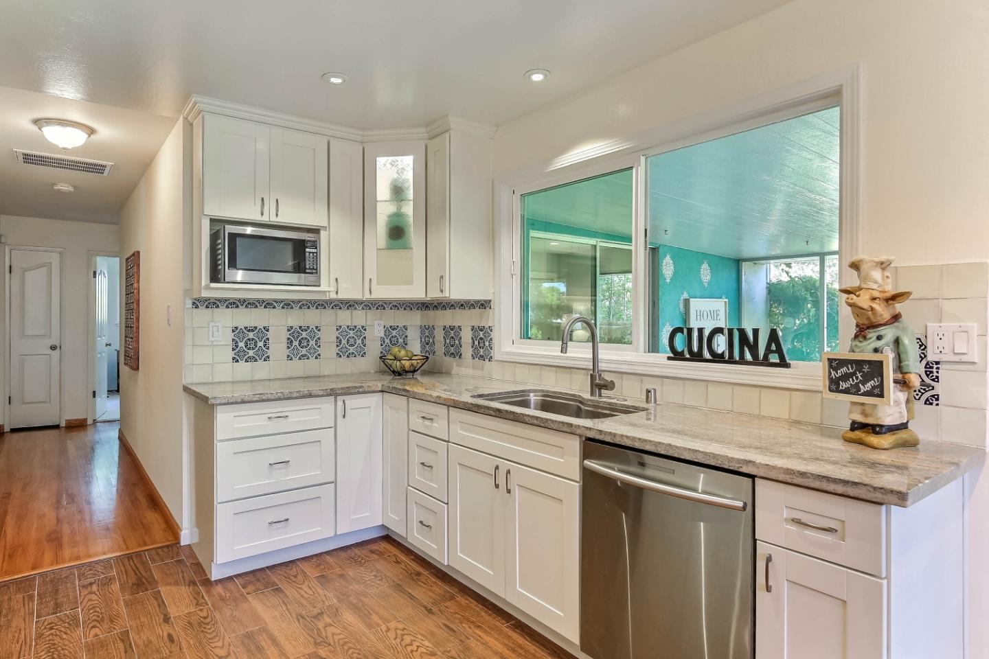 3666 Kirk Road San Jose, CA 95124 - Photo 5 of 13 a kitchen with granite countertop a sink stainless steel appliances and cabinets