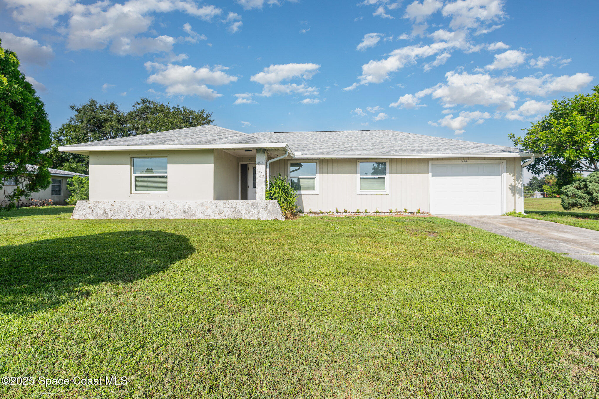 1194 Cotton Road Northeast Palm Bay, FL 32905 - Photo 2 of 33 002__amp3638-edit_270