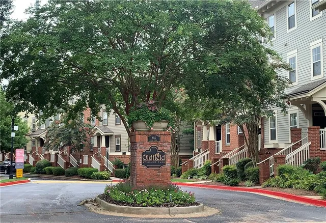 front view of a building with potted plants