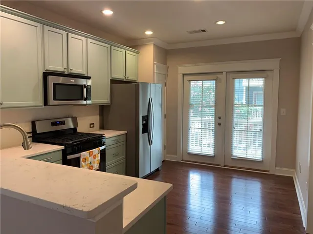 a view of a balcony with flower plants