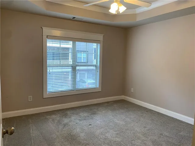 a bathroom with a toilet sink vanity and mirror