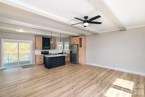 a kitchen with stainless steel appliances a sink stove and refrigerator