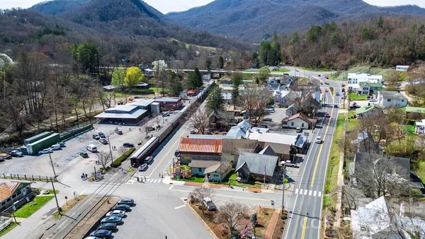 a view of a chairs and table in a balcony