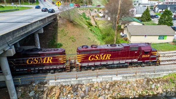 an aerial view of houses with yard