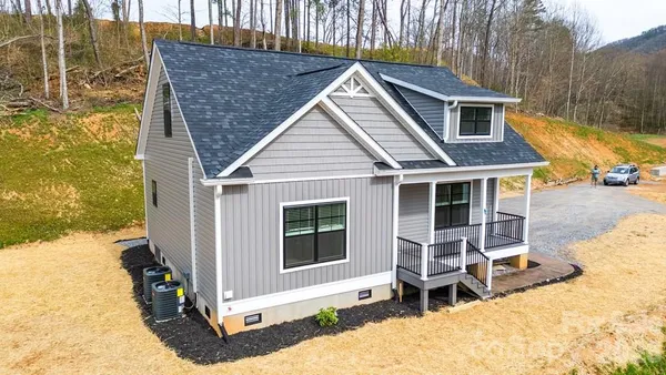 a front view of a house with a porch