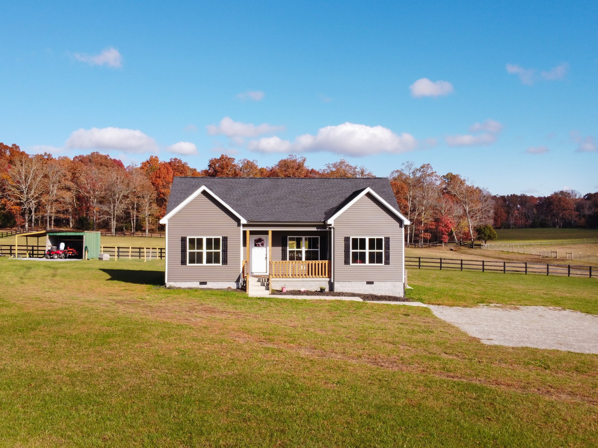 425 Pruett Road Dickson, TN 37055 - Photo 2 of 31 a front view of a house with a garden and swimming pool