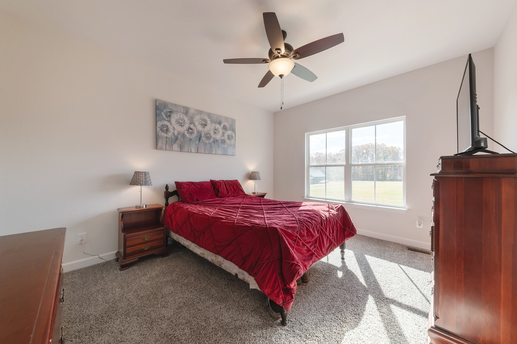 425 Pruett Road Dickson, TN 37055 - Photo 21 of 31 a bed sitting in a bedroom next to a window