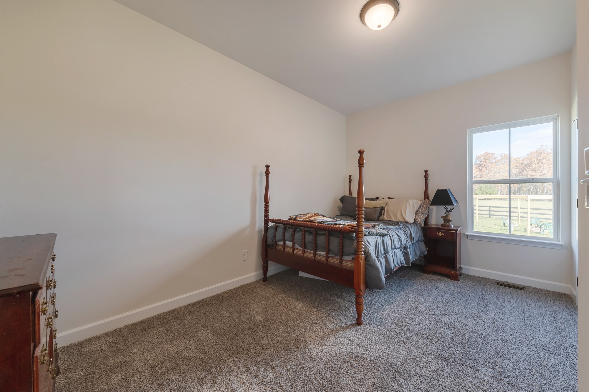425 Pruett Road Dickson, TN 37055 - Photo 24 of 31 a bed room with furniture and a window