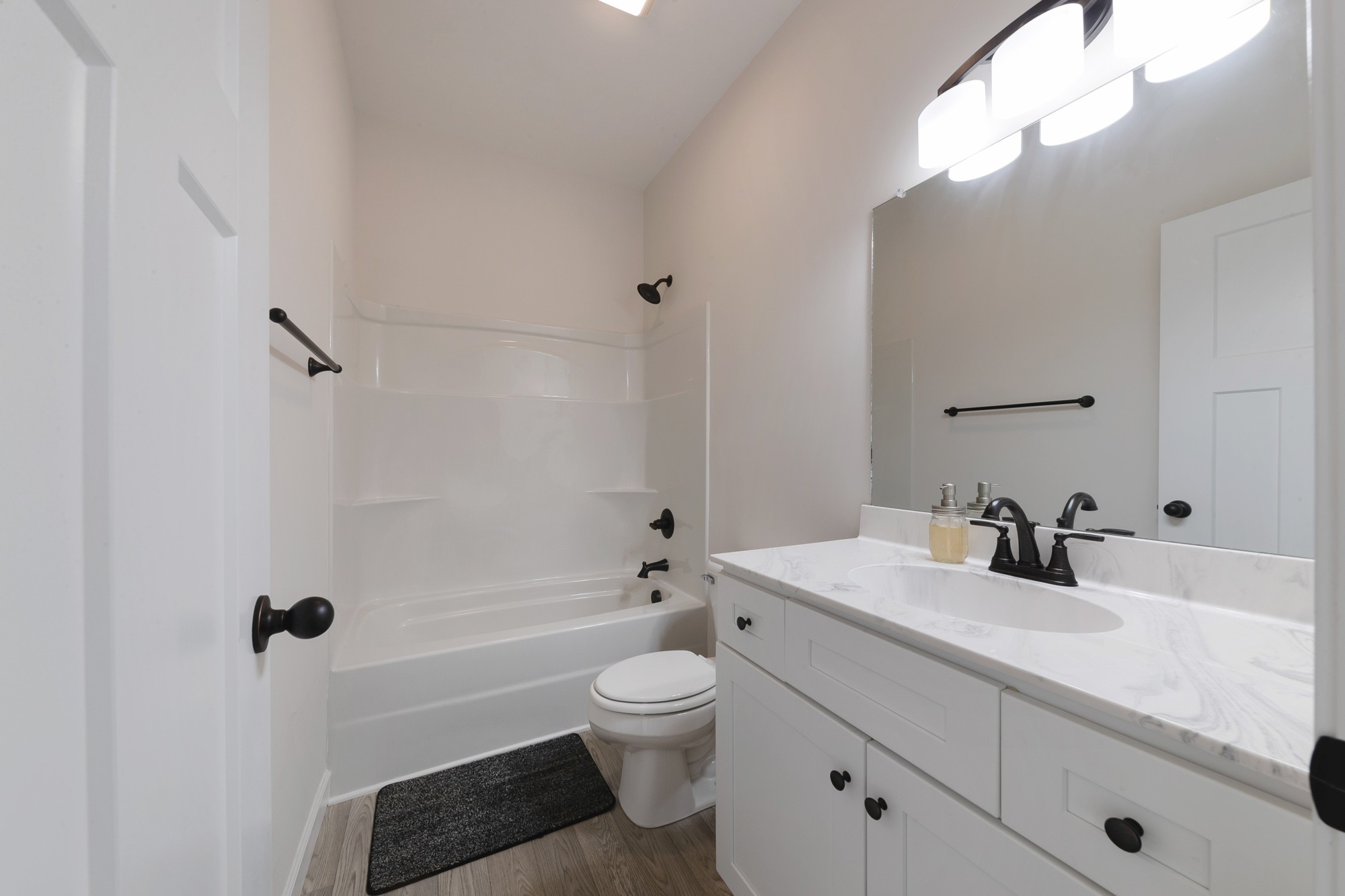 425 Pruett Road Dickson, TN 37055 - Photo 26 of 31 a bathroom with a granite countertop sink a toilet and a bathtub