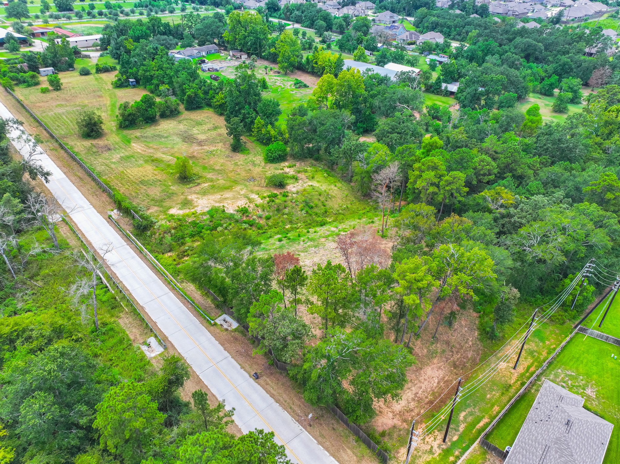 25635 Hufsmith Cemetery Road Tomball, TX 77375 - Photo 28 of 50 From the air, the generous proportions of this extraordinary acreage property come through with stunning clarity — wide open land in every direction, mature natural boundaries, and a sense of space and freedom that can only be found in a property of this remarkable scale in the greater Tomball, Texas countryside. This is Texas land at its finest.