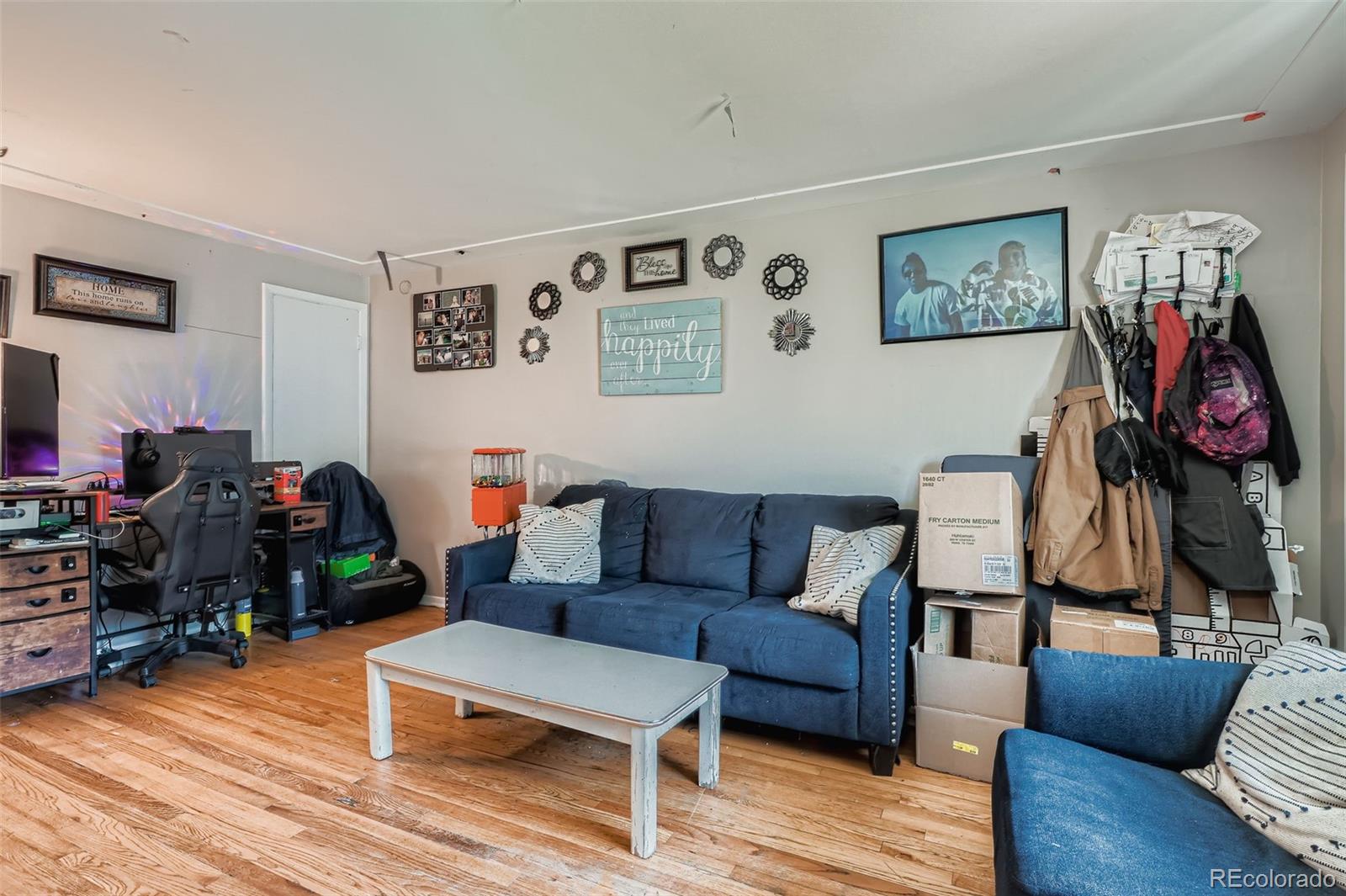 8805 West 46th Avenue Wheat Ridge, CO 80033 - Photo 14 of 25 a living room with furniture and wooden floor