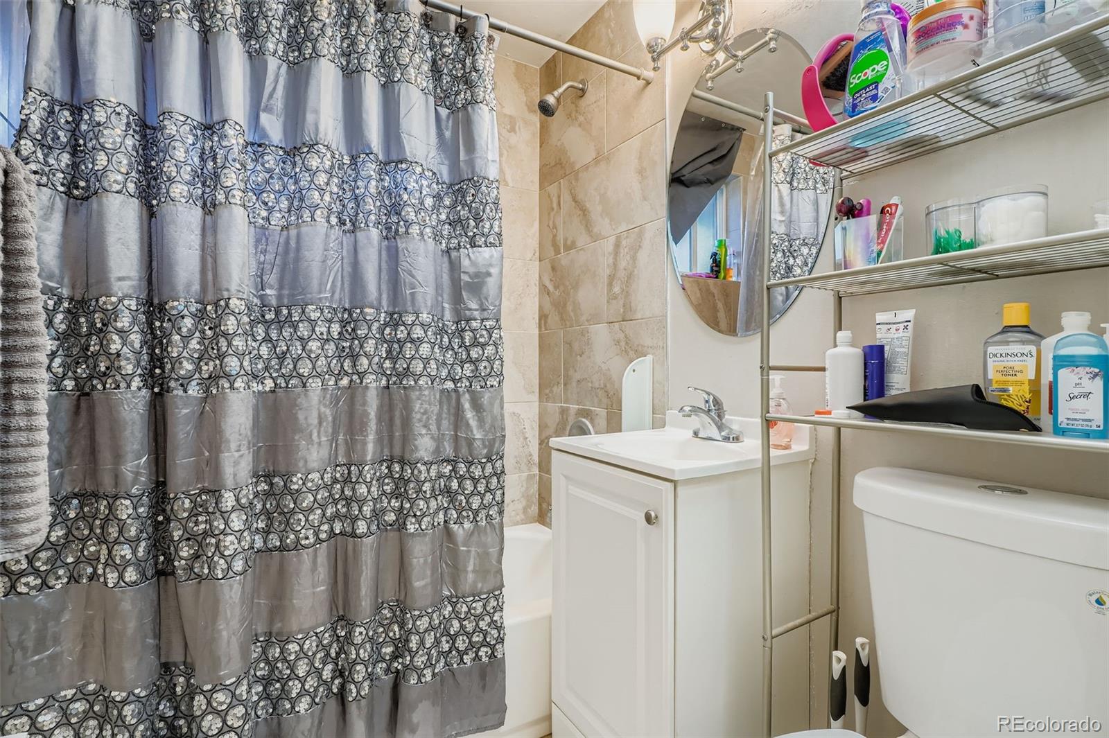 8805 West 46th Avenue Wheat Ridge, CO 80033 - Photo 9 of 25 a bathroom with mirror and shower